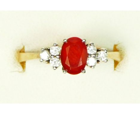 A 9ct gold, fire opal and brilliant cut diamond set dress ring, London 1987, M 1/2, 2.1gm 