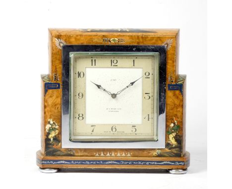 A 1920's Art Deco English Chinoiserie mantel clock, having a silvered dial with arabic numerals and chrome chapter ring , ins