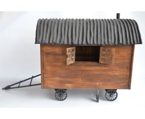 Large homemade wooden shepherds hut model with removeable roof to reveal detailed interior complete with a box of accessories