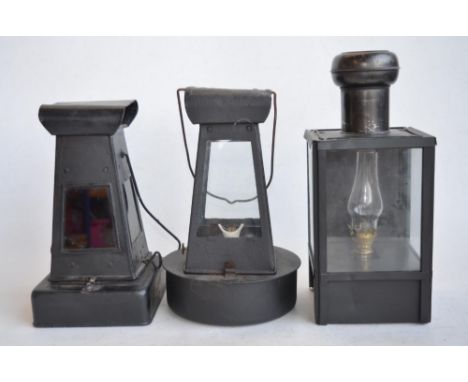 World War II British blackout oil lantern (missing sloped side light inhibitor panels), a similarly designed oil lamp (possib