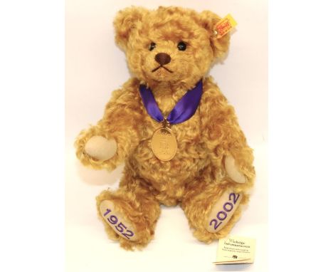 Steiff teddy bear: Golden Jubilee (1952-2002) 660740, golden mohair, with purple ribbon and medallion, H29cm 
