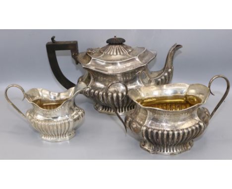 Georgian style three-piece silver tea service by Joseph Gloster, Birmingham, 1910, gross 29 ozt. (3) 