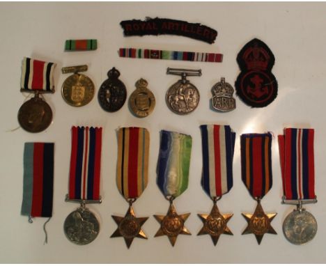 Collection of Medals and badges from WWI WWII. British War Medal1914-18 awarded to John Wilson, On War Service 1915, Penny Tr