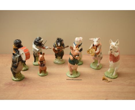 A Beswick Pottery 'Pig Parade' comprising 'John' PP1, 'Matthew' PP2 bugle is loose 'David' PP3 broken flute, 'Andrew' PP 4, '