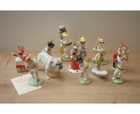 A group of nine Royal Doulton bone china Bunnykins characters including 'Aussie Surfer Bunnykins' DB133 and 'Wicketkeeper Bun