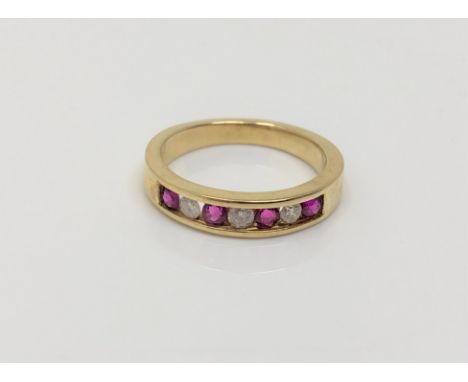An 18ct gold ruby and diamond ring, size J CONDITION REPORT: 2.9g