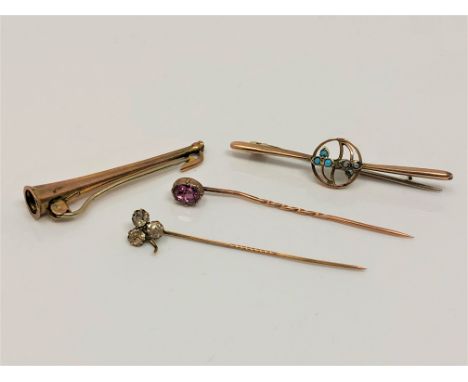 Four gold pins/brooches including hunting horn, Georgian paste example etc