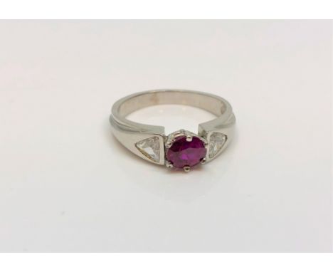 An 18ct white gold ruby and diamond ring, approximately 0.5ct, size K.