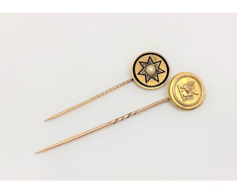 Two gold stick pins; one depicting a sphinx, the other with enamel and central pearl (2) CONDITION REPORT: 7g gross