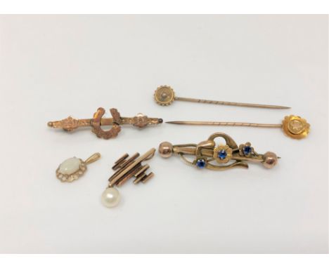 Two 15ct gold pins, a 14ct gold pearl pendant, a gold opal pendant and two 9ct gold pins CONDITION REPORT: 7.3g gross. 