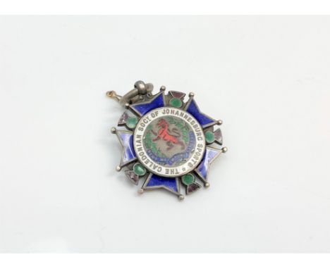 A silver and enamel medal for the Caledonian society of Johannesburg