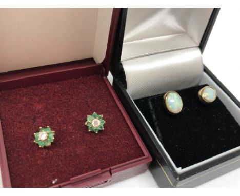 A pair of gold opal earrings and a pair of emerald and diamond earrings 