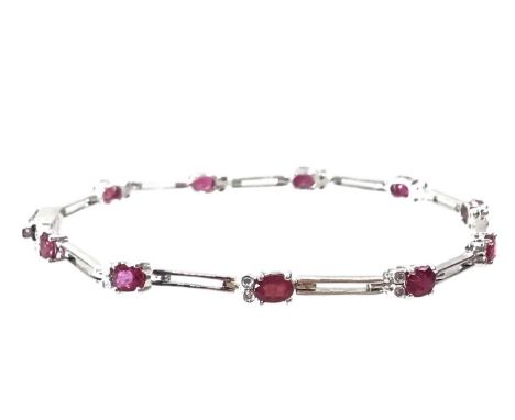RUBY AND DIAMOND BRACELET, in eighteen carat white goldQty: 8.1gThe bracelet is 19cm long and is in overall good condition, w