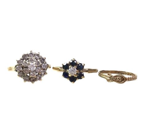 THREE GOLD RINGS, ALONG WITH A GOLD CHAIN,  two rings with dress stones, along with a buckle design ring and a gold chain, al