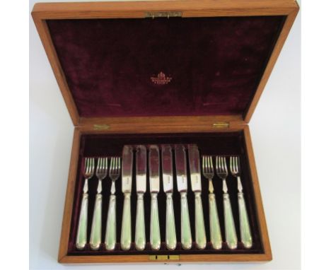 A set of six hallmarked fish knives and forks, Sheffield 1909, Harrison Brothers of Howson, in a Mallet and Sons fitted oak c