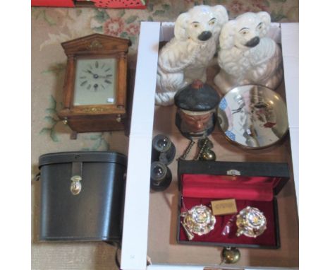 A box containing a pair of Staffordshire dogs, oak cased mantle clock, two pairs of binoculars, Oriental plates and other rel