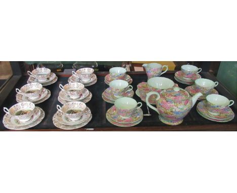 A Shelley Rock Garden pattern tea service, comprising: teapot, cake plate, sugar bowl, milk jug and six trios, together with 