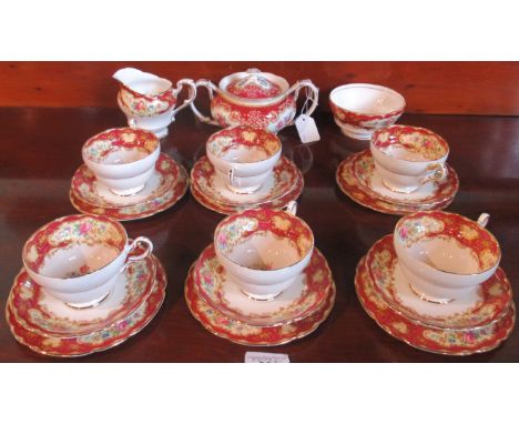 A Paragon six piece tea service, comprising: twin handled sugar bowl, cream jug, slop bowl and six trios with gilt and floral