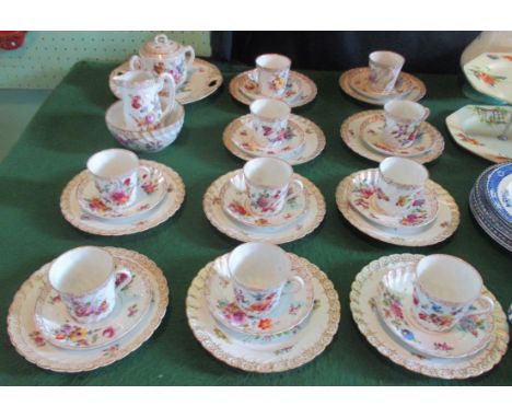 A 20th century Dresden porcelain tea service, comprising: cake plate, twin handled sugar bowl, milk jug, slop bowl and ten tr