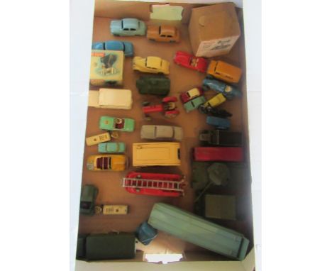 A collection of play worn Dinky Toys, to include: fire engine, car transporter, Army vehicles and other associated toys.
