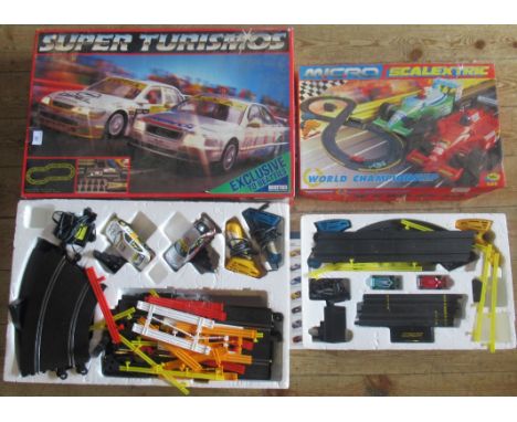 A Super Turismos Racing Car Set, together with a Micro Scalextric Racing Set.