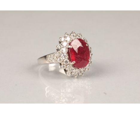 Ladies eighteen carat white gold ruby and diamond dress ring, ruby approximately 7.5 carats, diamonds approximately 3 carats,