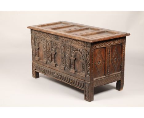 Oak carved coffer chest, with fitted drawer, oak four panel lid, over three carved arches to the front, length 131cm, width 6
