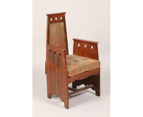 Oak arts and crafts armchair, with pierced heart decoration, width 56.5cm, height 102cm CONDITION REPORT:The chair is in very