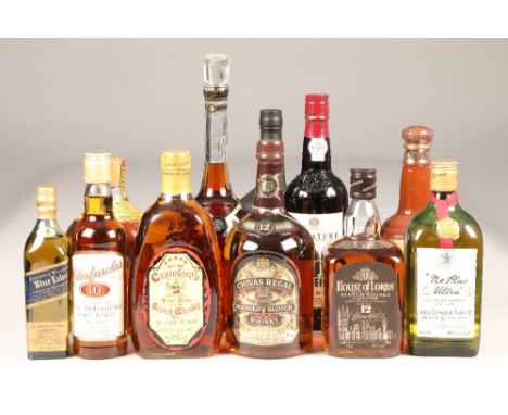 Eight assorted bottles of whisky, two bottles of port and a cognac including: Bells blended scotch whisky, 40% vol, 75cl., Ne