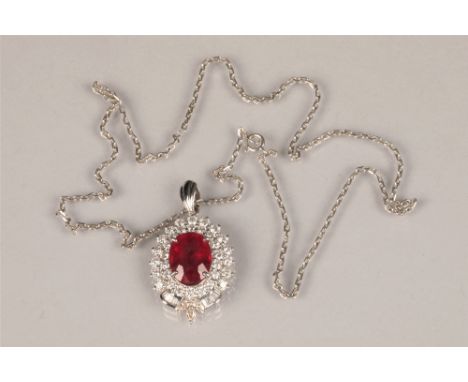 Ladies eighteen carat white gold ruby and diamond pendant, a combination of round brilliant cut and baguette cut diamonds, ap