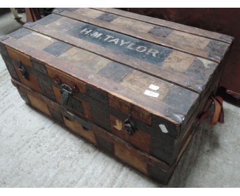 A vintage banded travel trunk