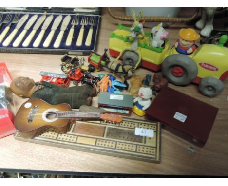 A selection of toys  and games including cribbage board