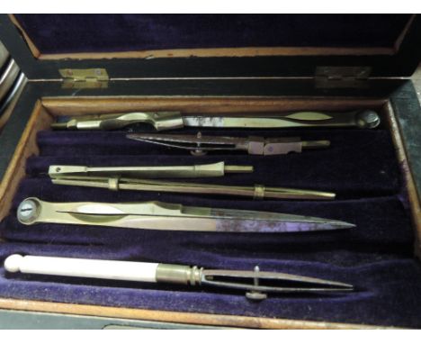 A vintage set of maths instruments in treen box 
