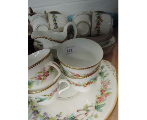 A part vintage tea service with leaf, floral and berry design and gilt rim