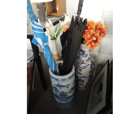 A tall vase of oriental design and similar umbrella stand, (the umbrella was once held by Michael Jackson as he left the vend