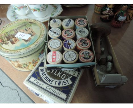 A selection of haberdashery including treen darning mushroom, thimbles, vintage tins of buttons and boxes of sewing cotton, t