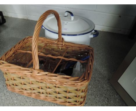 A round enamel bread bin and a bottle basket 