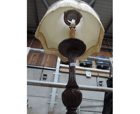 A mahogany standard lamp