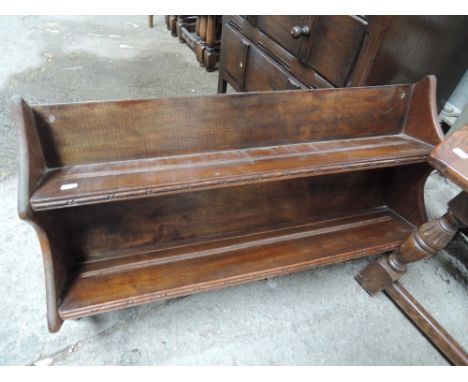 An early 20th Century oak wall shelf