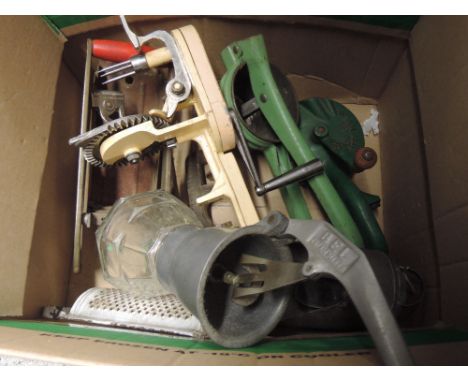 A box of vintage kitchen utensils including a Spong & Co Ltd Bean Slicer No633, a Kwikpeel apple peeler and a BEL cream maker