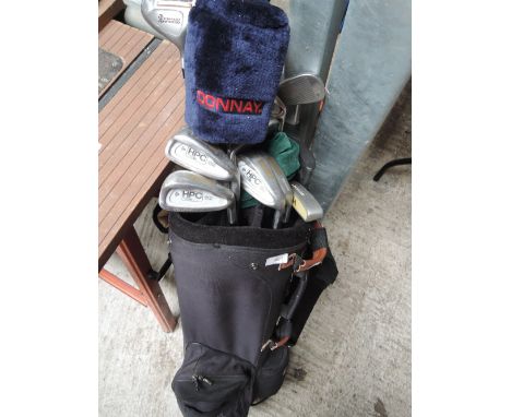 A set of Dunlop golf clubs, golf bag and trolley