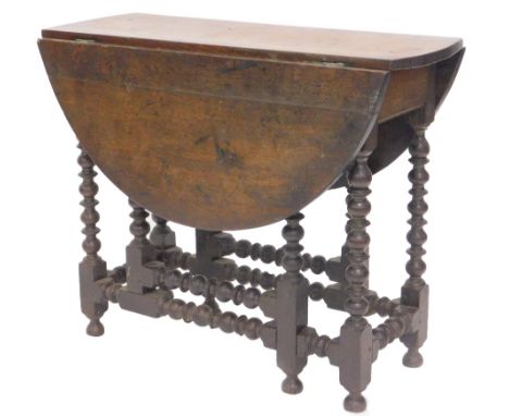 An antique bobbin turned gate leg table, constructed from late 17thC and later timbers, 95cm L.