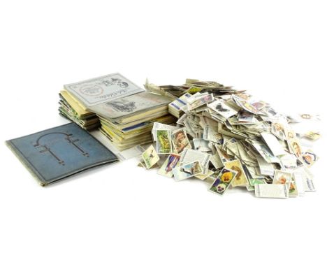 A large quantity of loose cigarette cards, in albums, etc.