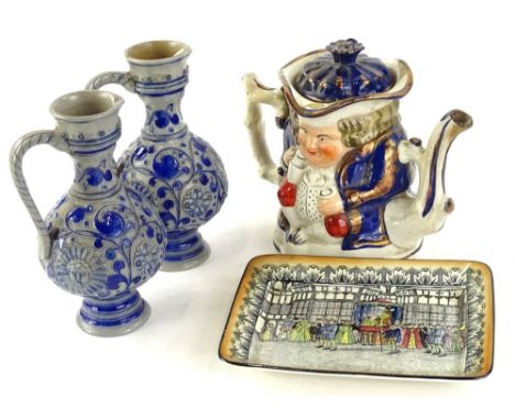 A collection of ceramics, to include a pair of stoneware ewer's, a Staffordshire Toby teapot with lustre decoration and a Roy