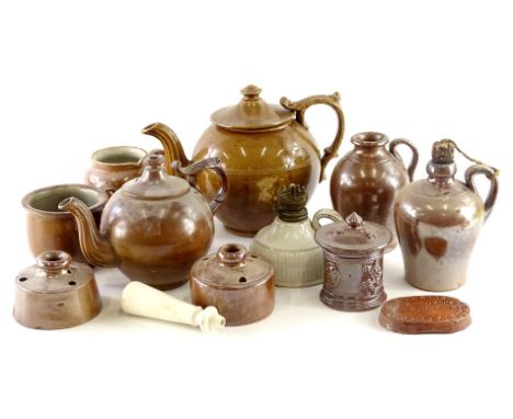 A collection of stoneware, to include a dark glazed teapot, small jar and cover, jug with side handle, small cup, two inkwell