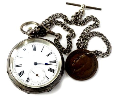 A continental silver cased pocket watch, with white enamel dial and silver watch chain with George V penny fob.