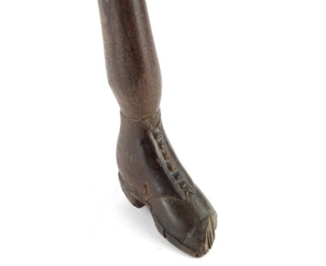 A 19thC hardwood Sunday type walking stick, the handle carved as a boot, (AF), 97cm L.
