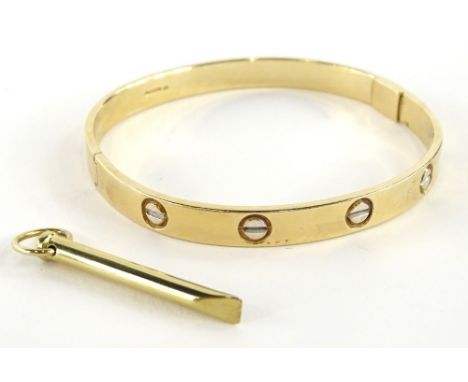 A 9ct gold bangle, with etched design, makers stamp BD, Sheffield assay, with winder, 6.5cm dia, 32.6g all in, boxed.