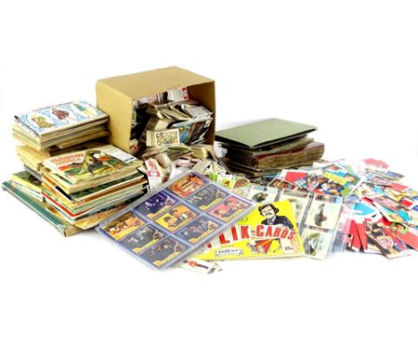 A large quantity of cigarette and trade cards, to include some albums.
