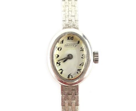 A Nappey silver ladies wristwatch, with small oval dial, on white enamel dial, silver casing on four bar design bracelet, 15c